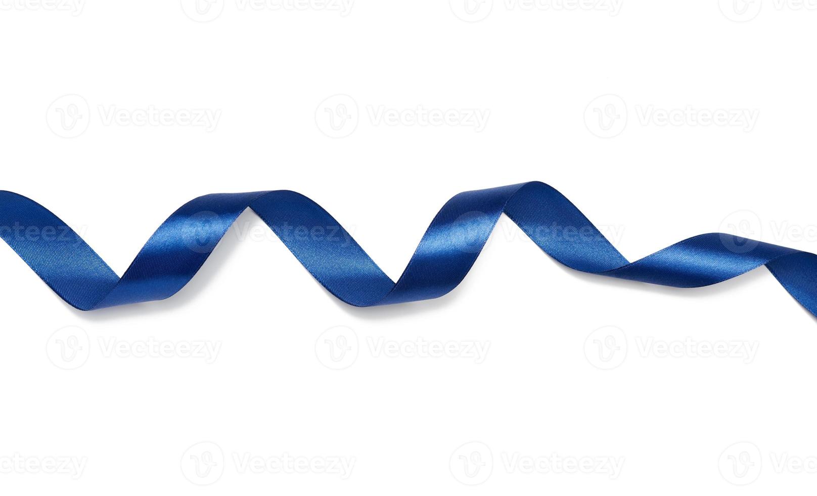 twisted blue silk ribbon isolated on white background photo