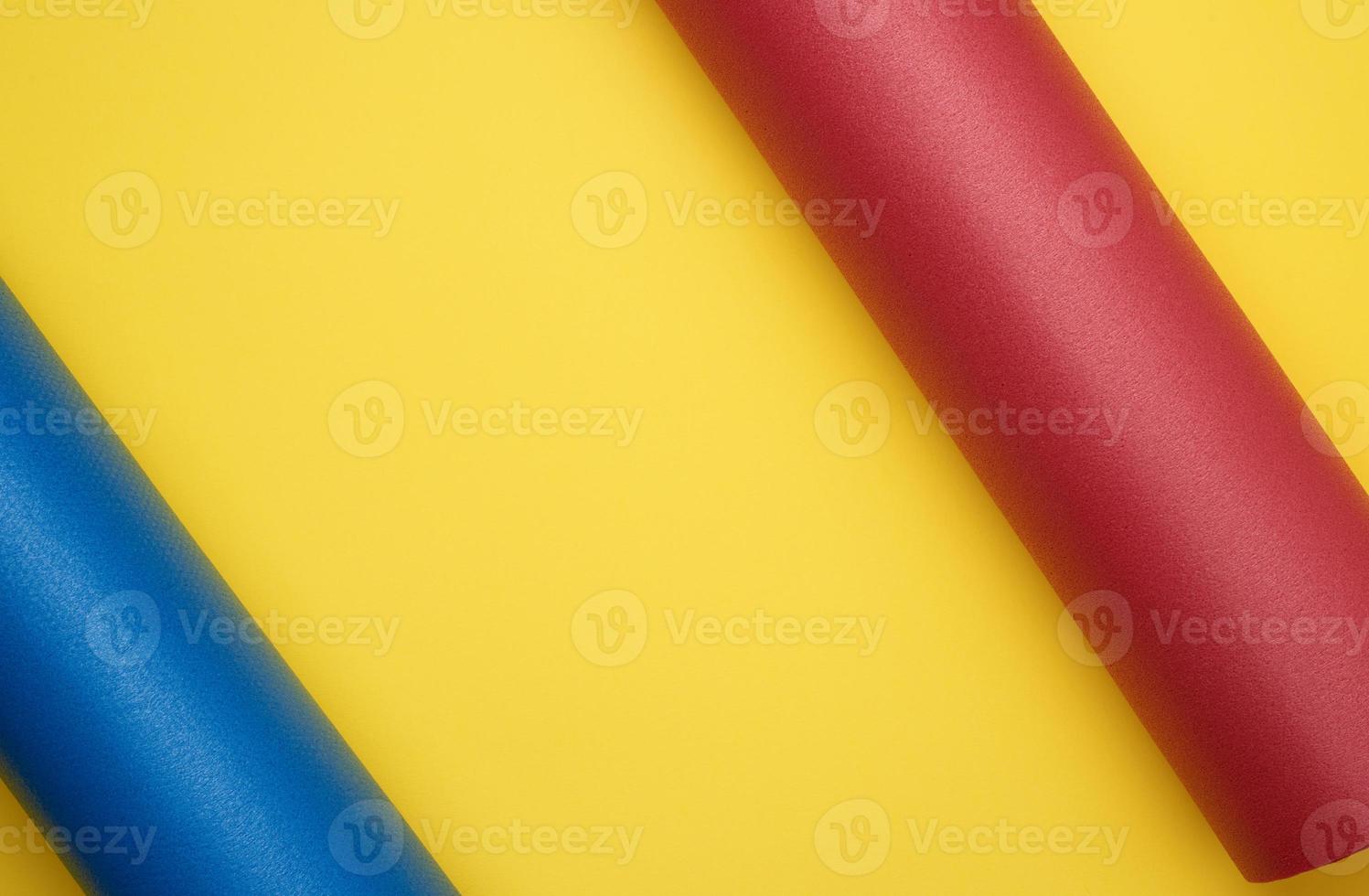 twisted red and blue neoprene mat for yoga and sports photo