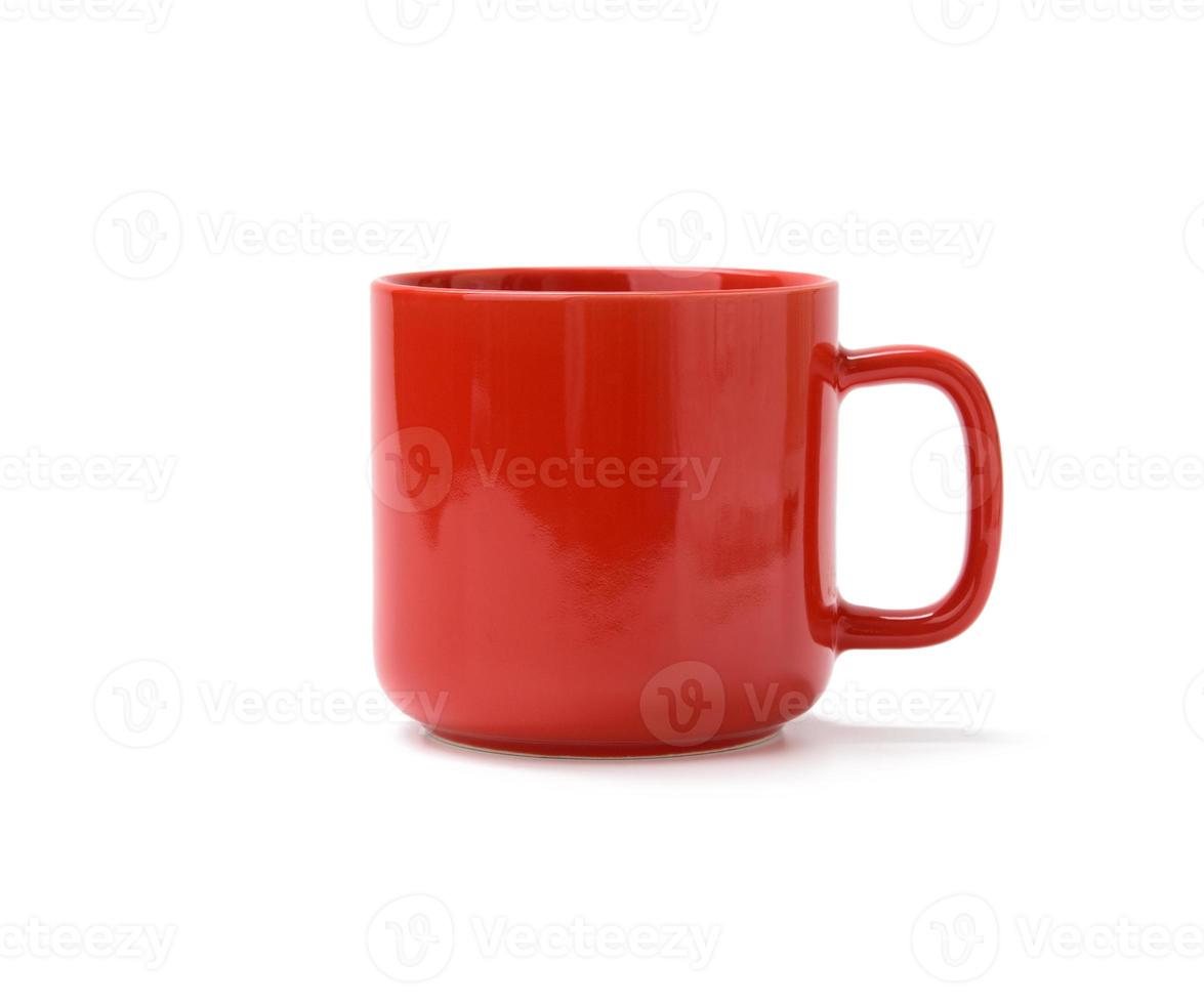 red ceramic mug with handle isolated on white background photo