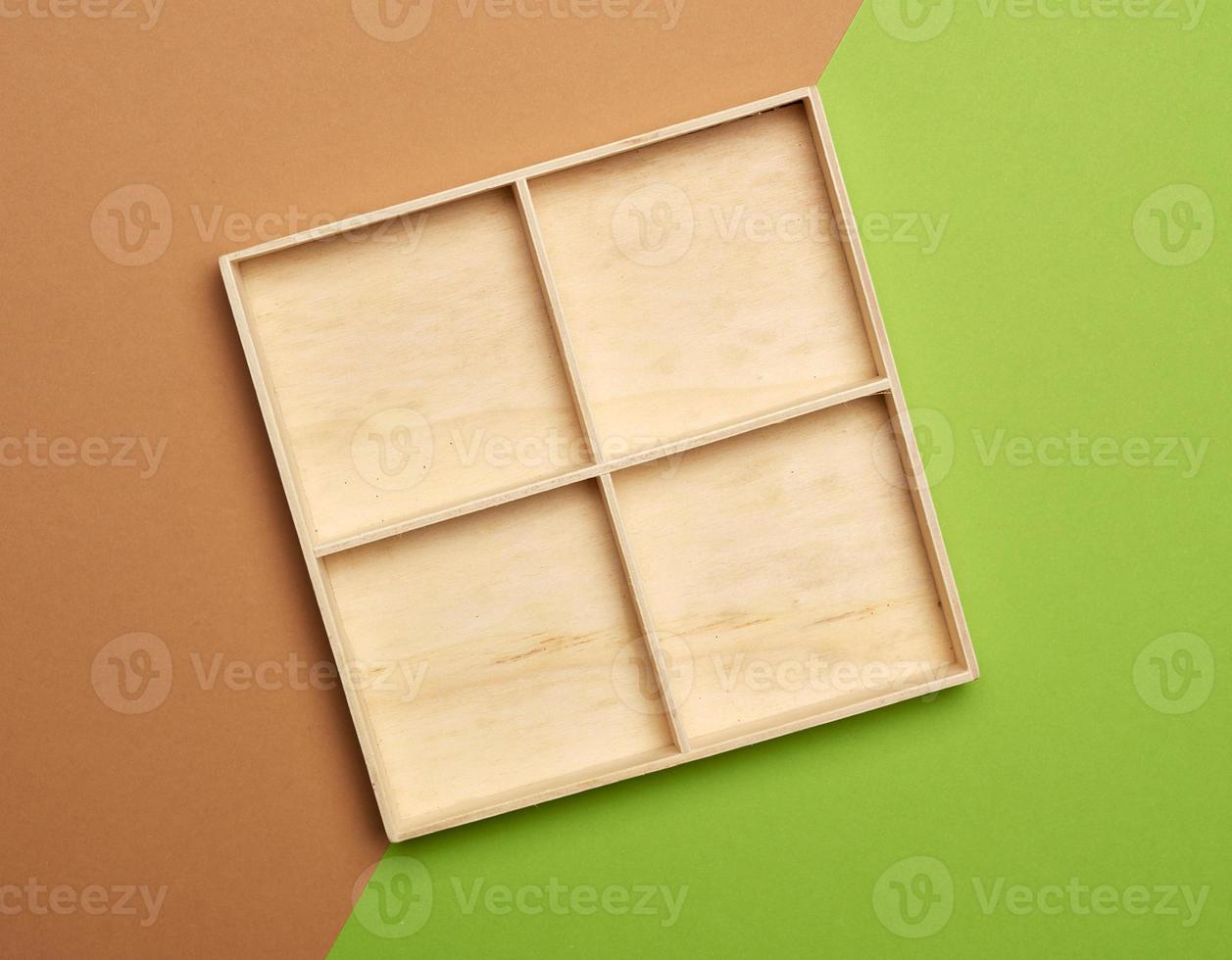 empty wooden box on green brown background, top view photo