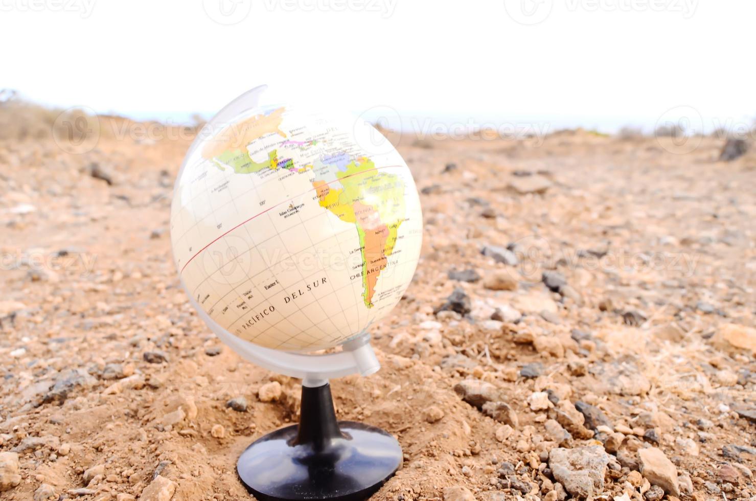 Globe on the ground photo