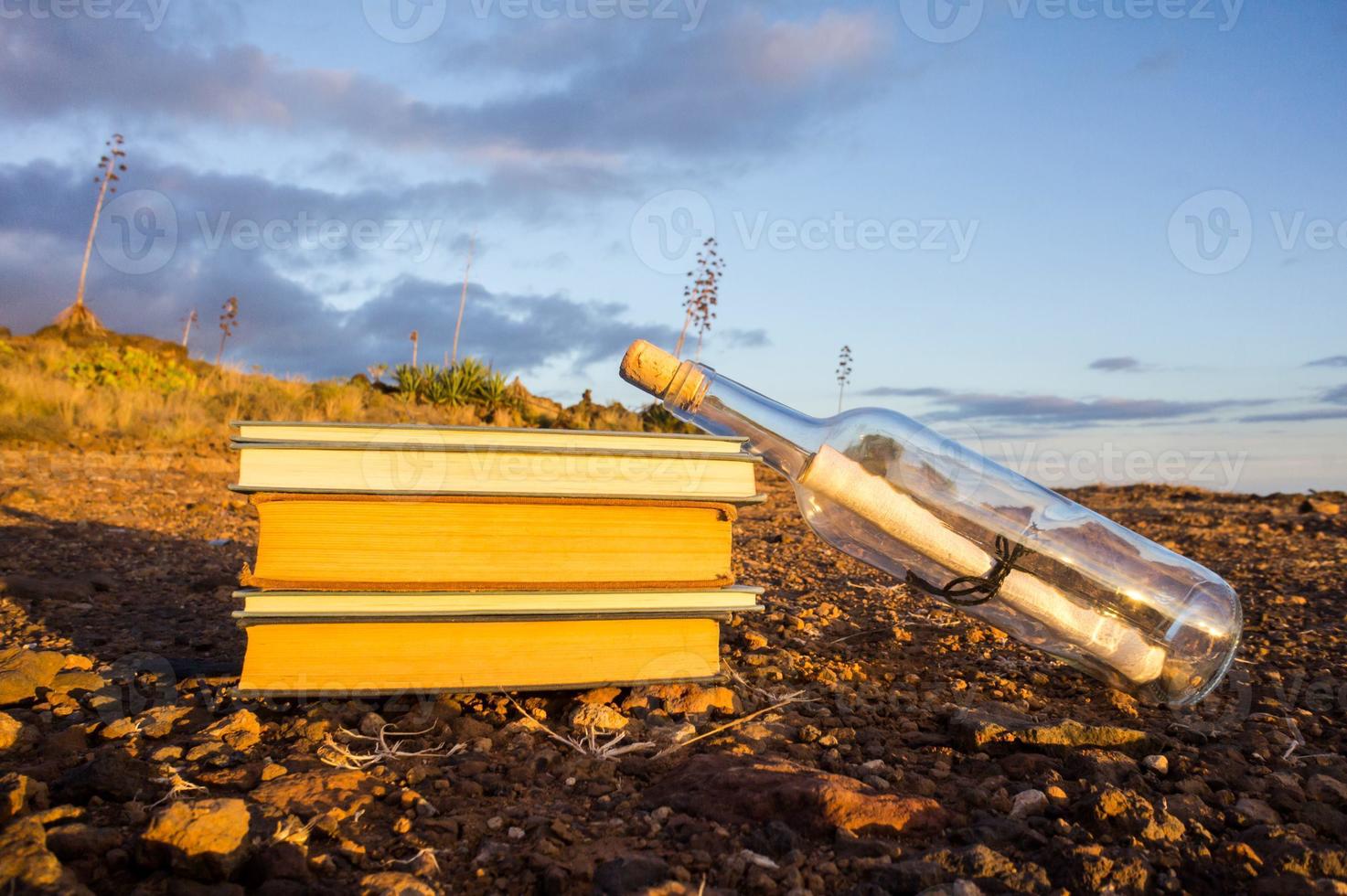 Stacked books on the ground photo