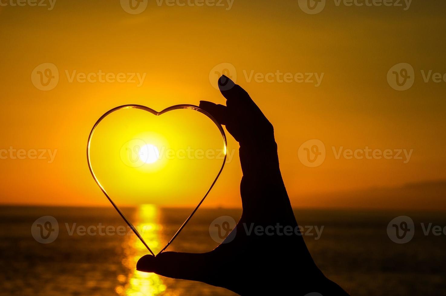 Heart shape over the sunset photo
