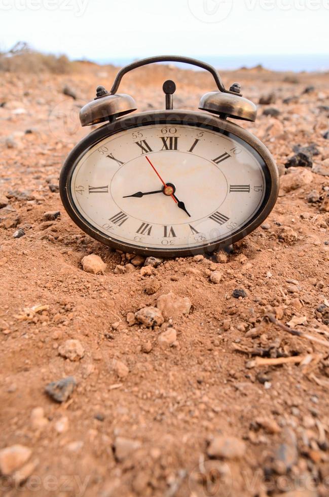 Clock on the ground photo