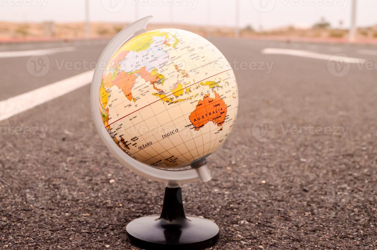 Globe on the road photo