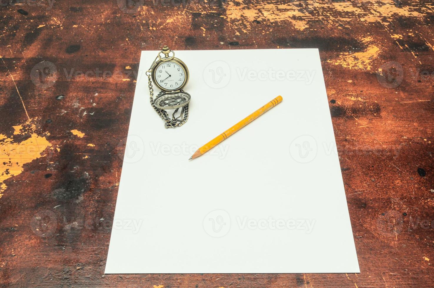 Pencil and paper on the table photo