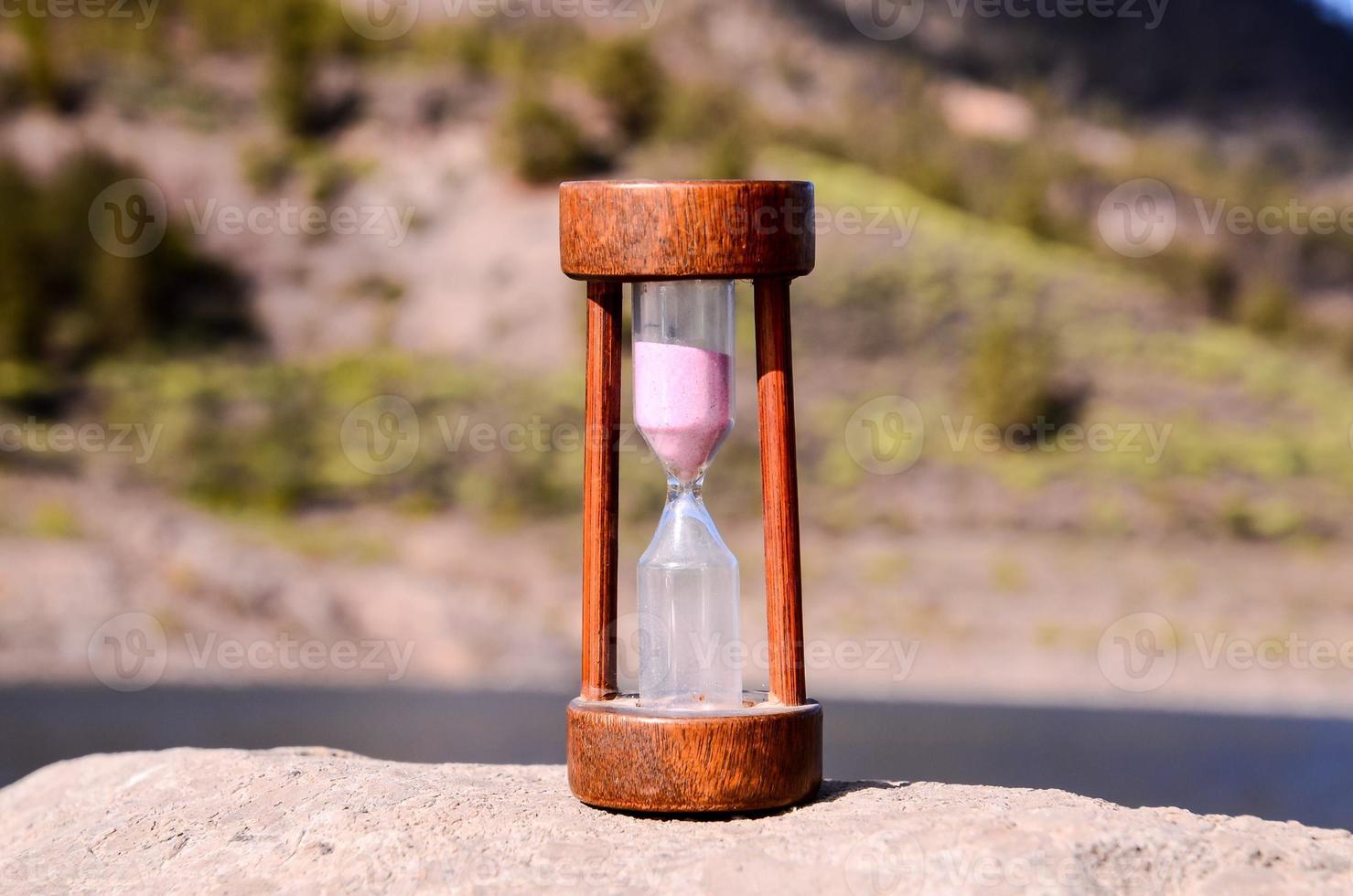 Hourglass on the rocks photo