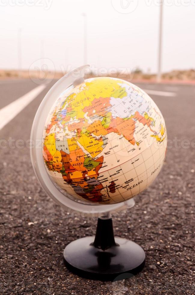 Globe on the road photo