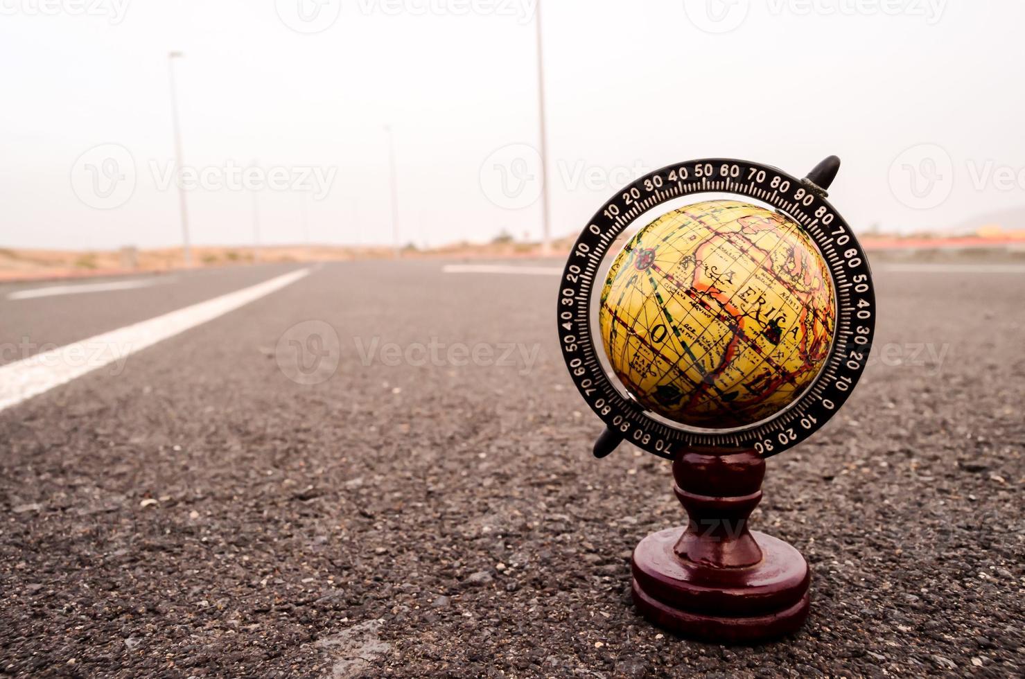 Globe on the road photo