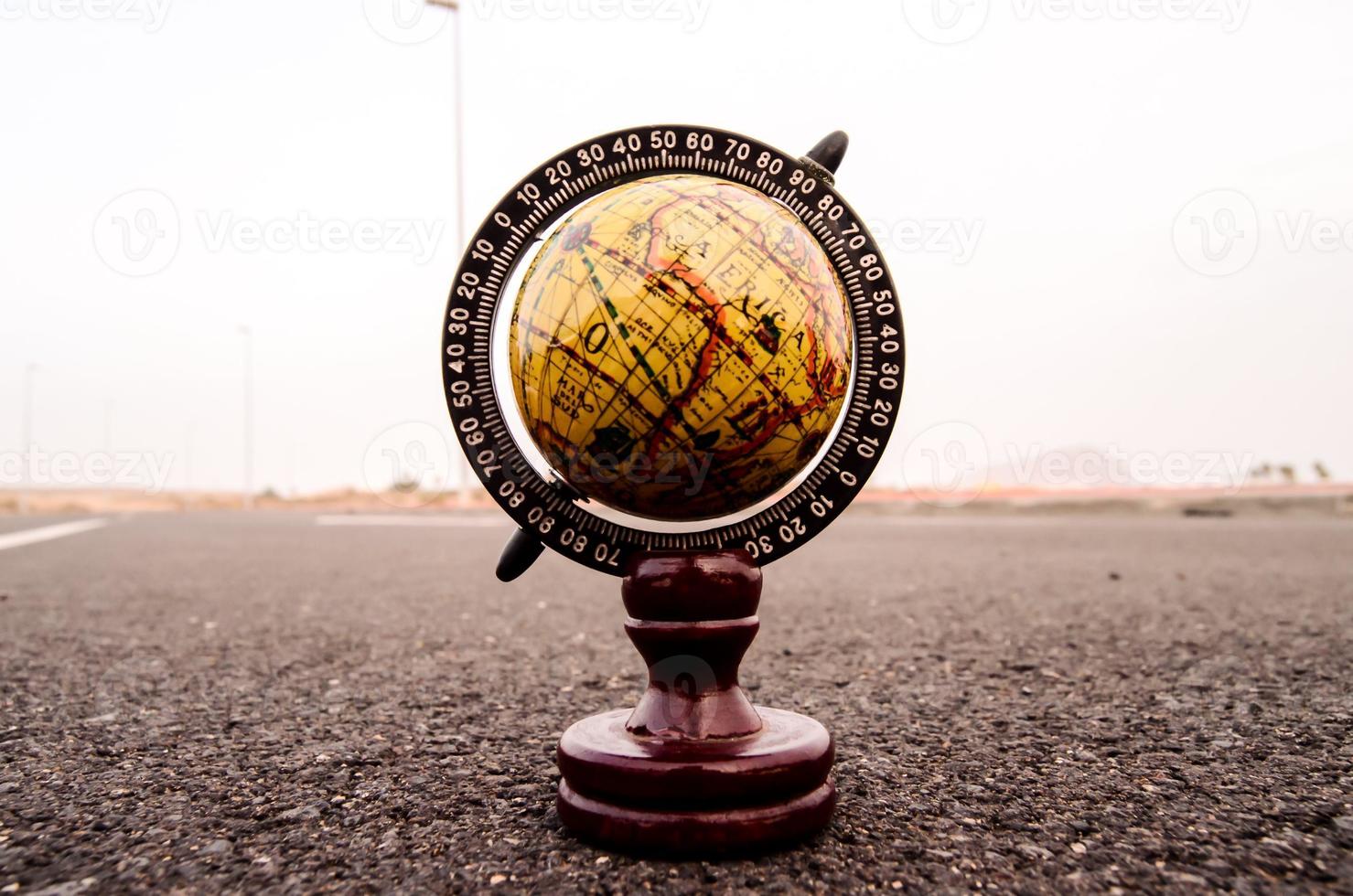 Globe on the road photo