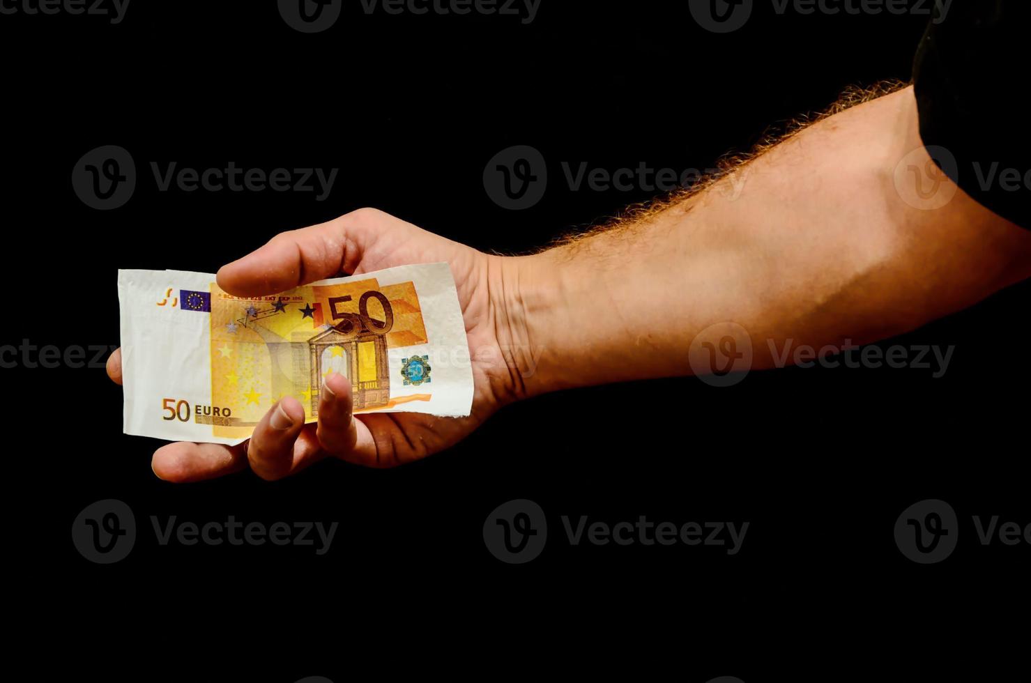 Hand holding cash photo