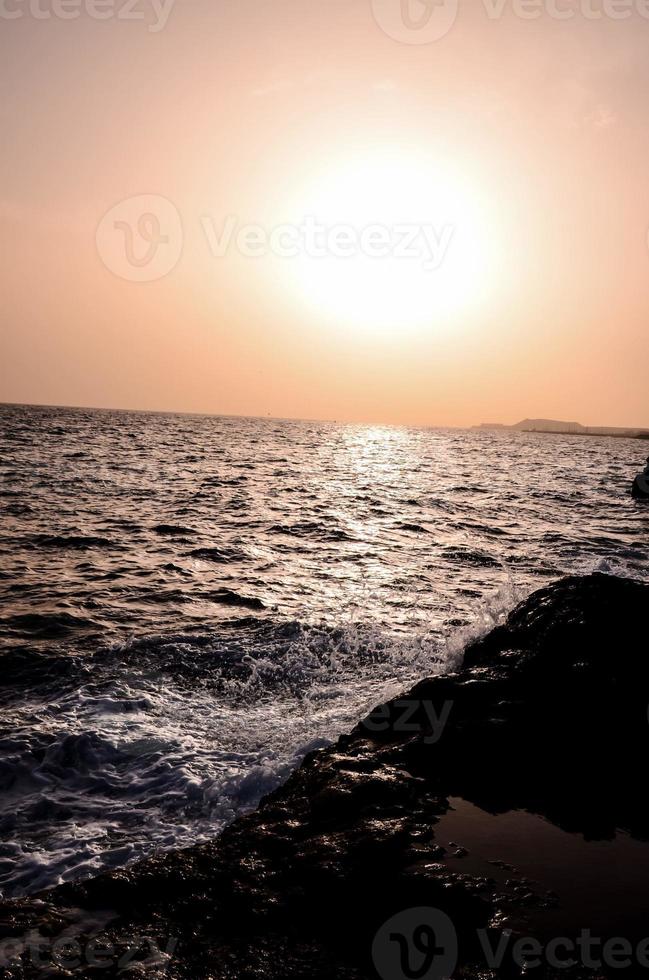 Ocean over the sunset photo