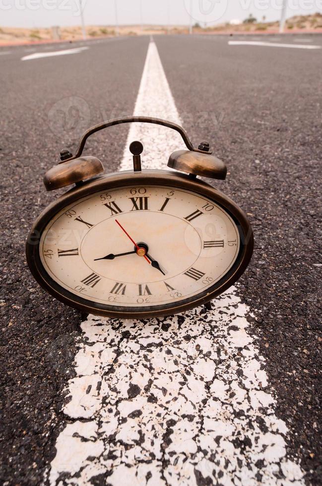 Clock on the ground photo