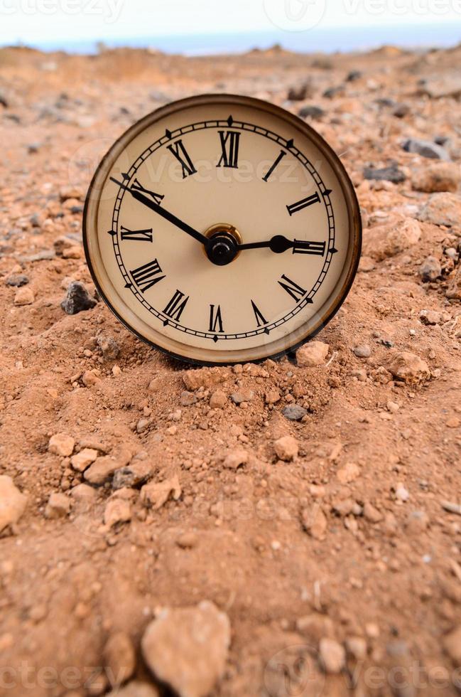 Clock on the ground photo