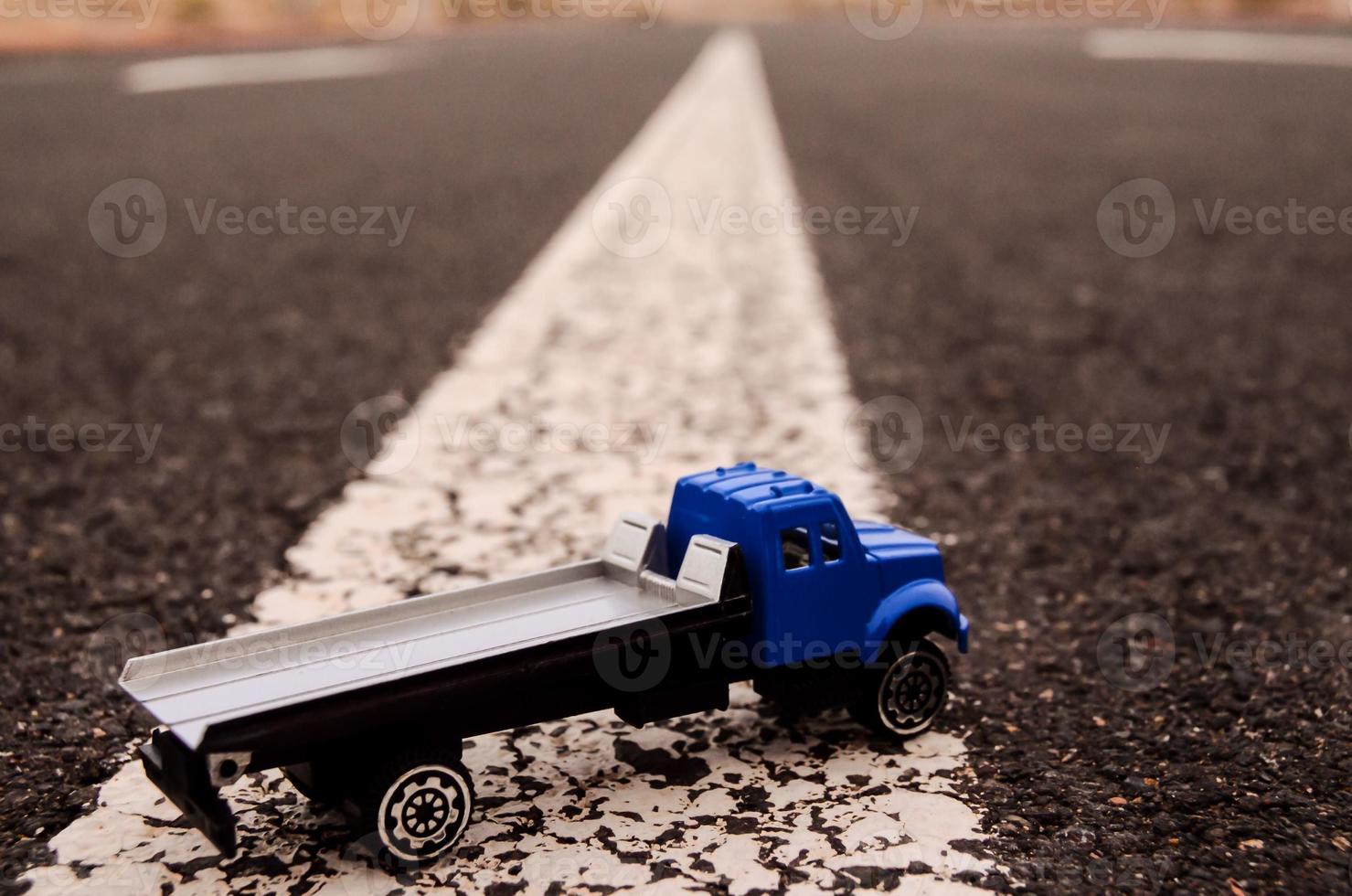 Toy truck on the road photo