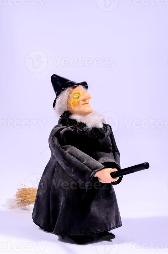 Little witch on white background photo