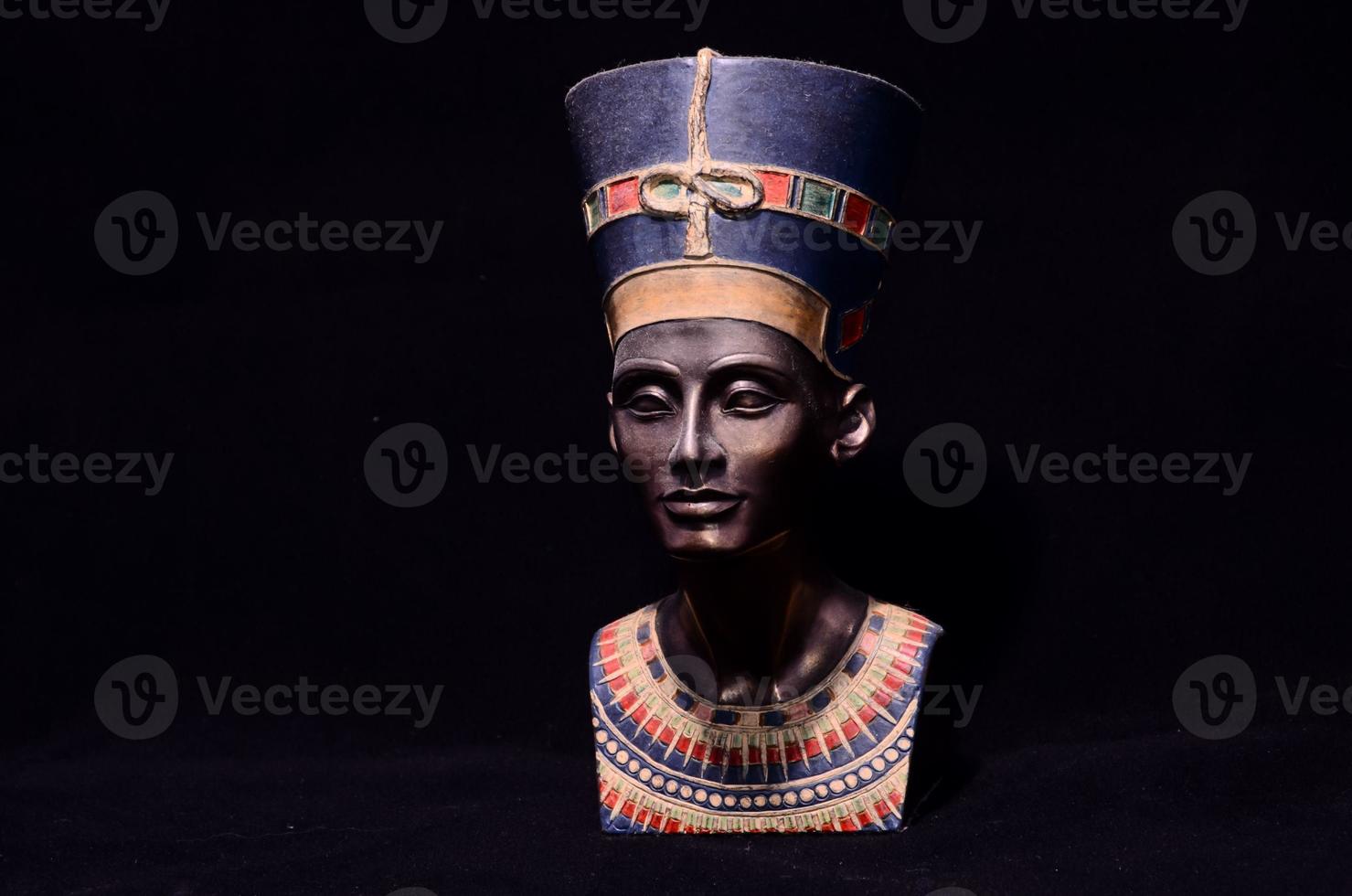 Nefertiti miniature on black background photo