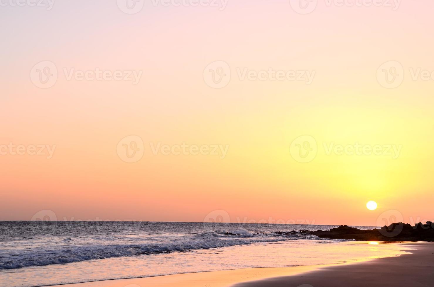Beach view over the sunset photo