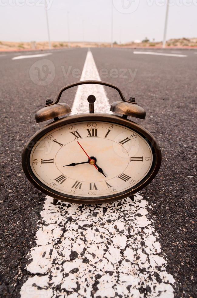 Clock on the ground photo
