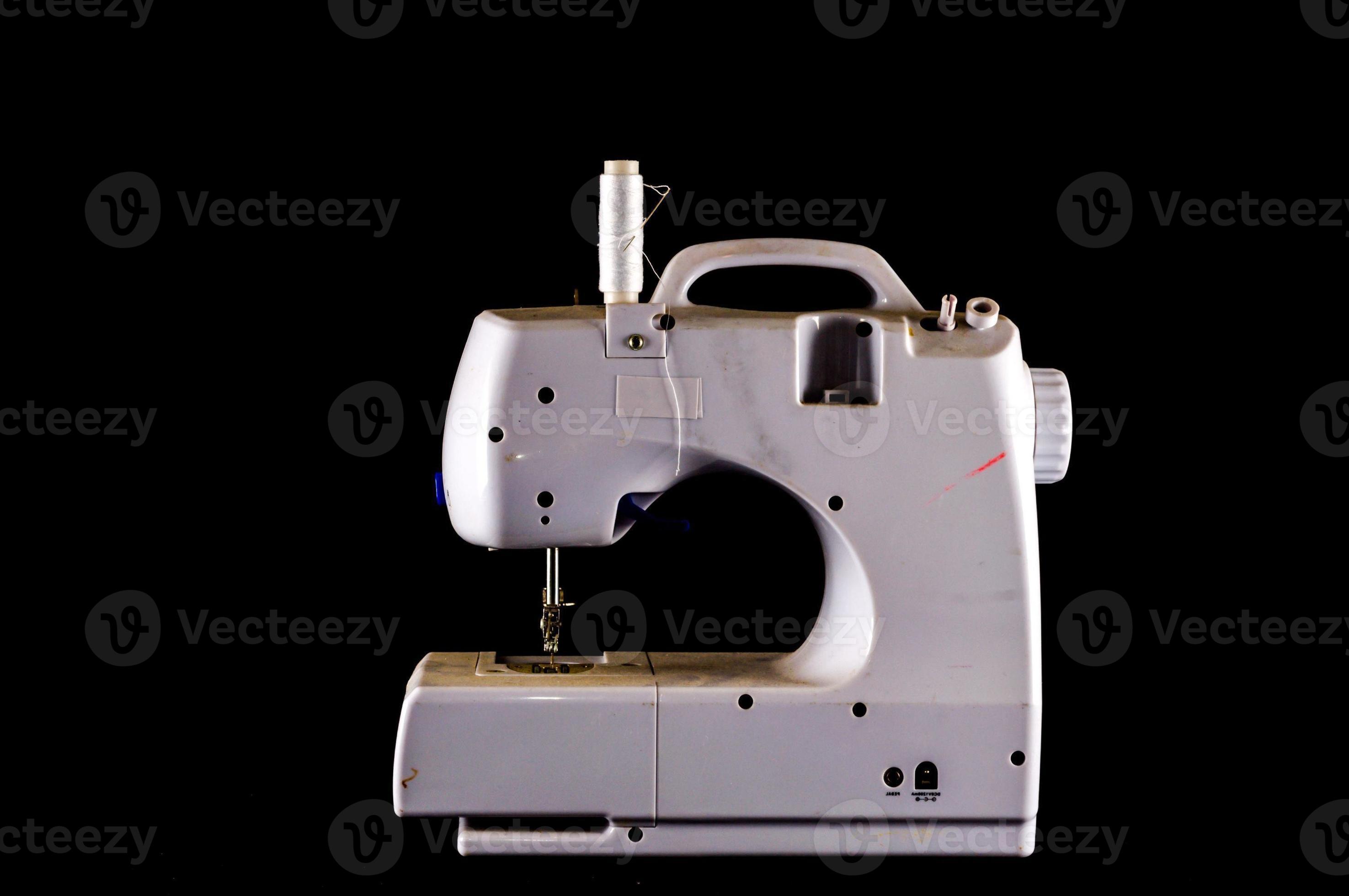Sewing machine on black background 17476301 Stock Photo at Vecteezy