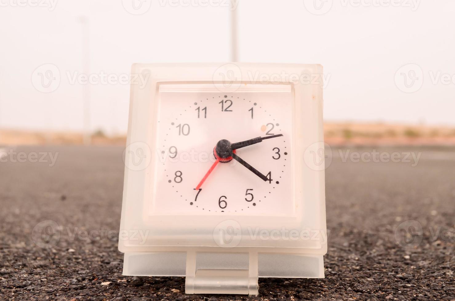 Clock on the ground photo