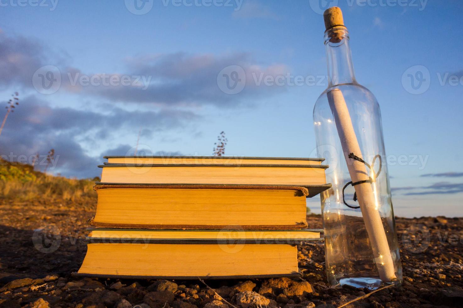 Stacked books on the ground photo