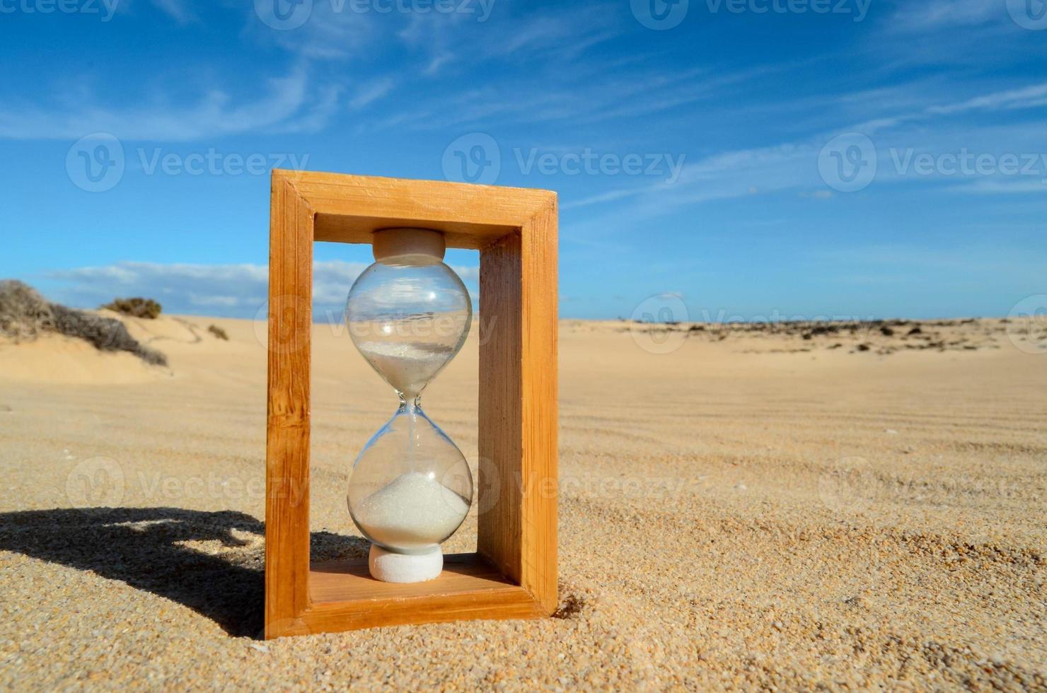 Hourglass on the beach photo