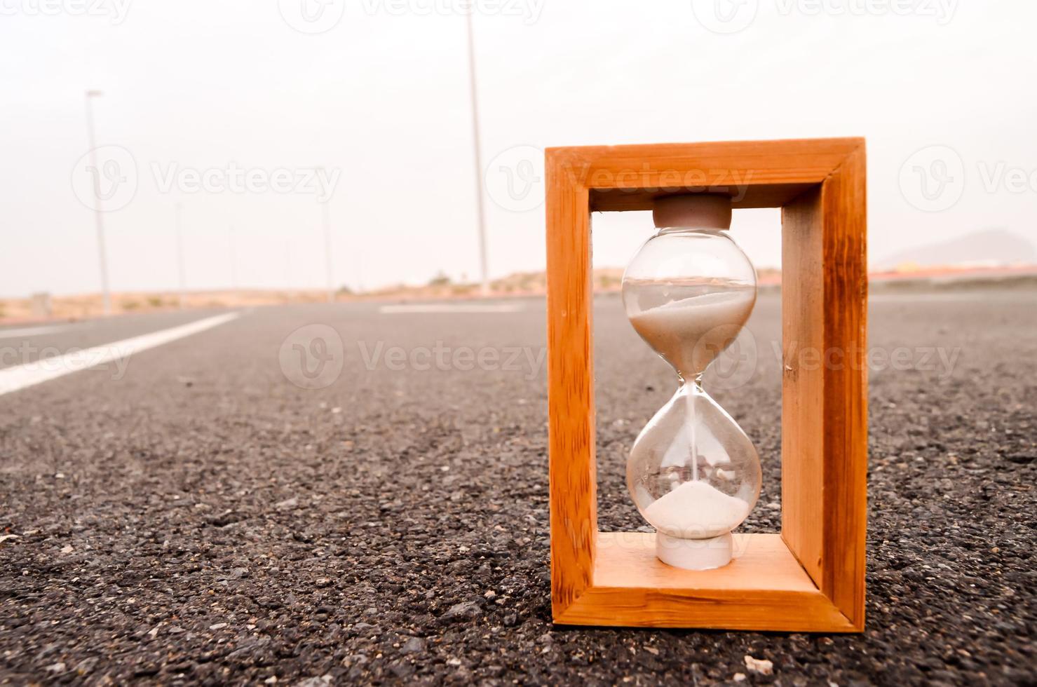 Hourglass on the road photo