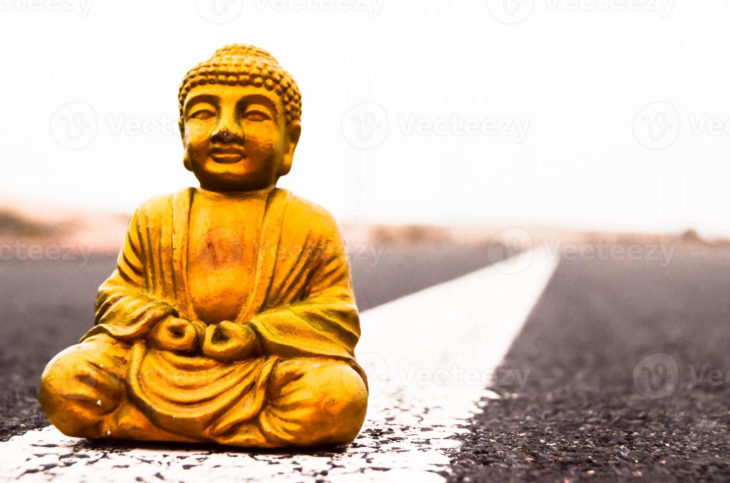 Buddha miniature on the road photo