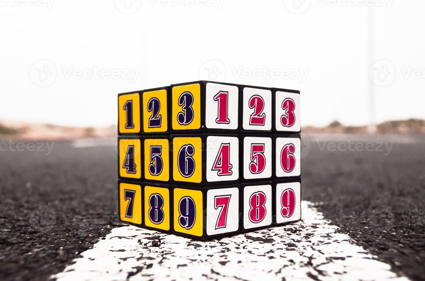 Numbered cube on the road photo