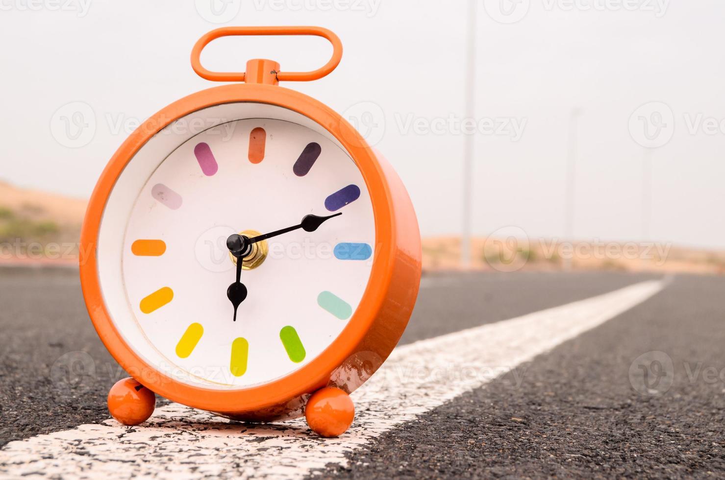 Clock on the road photo