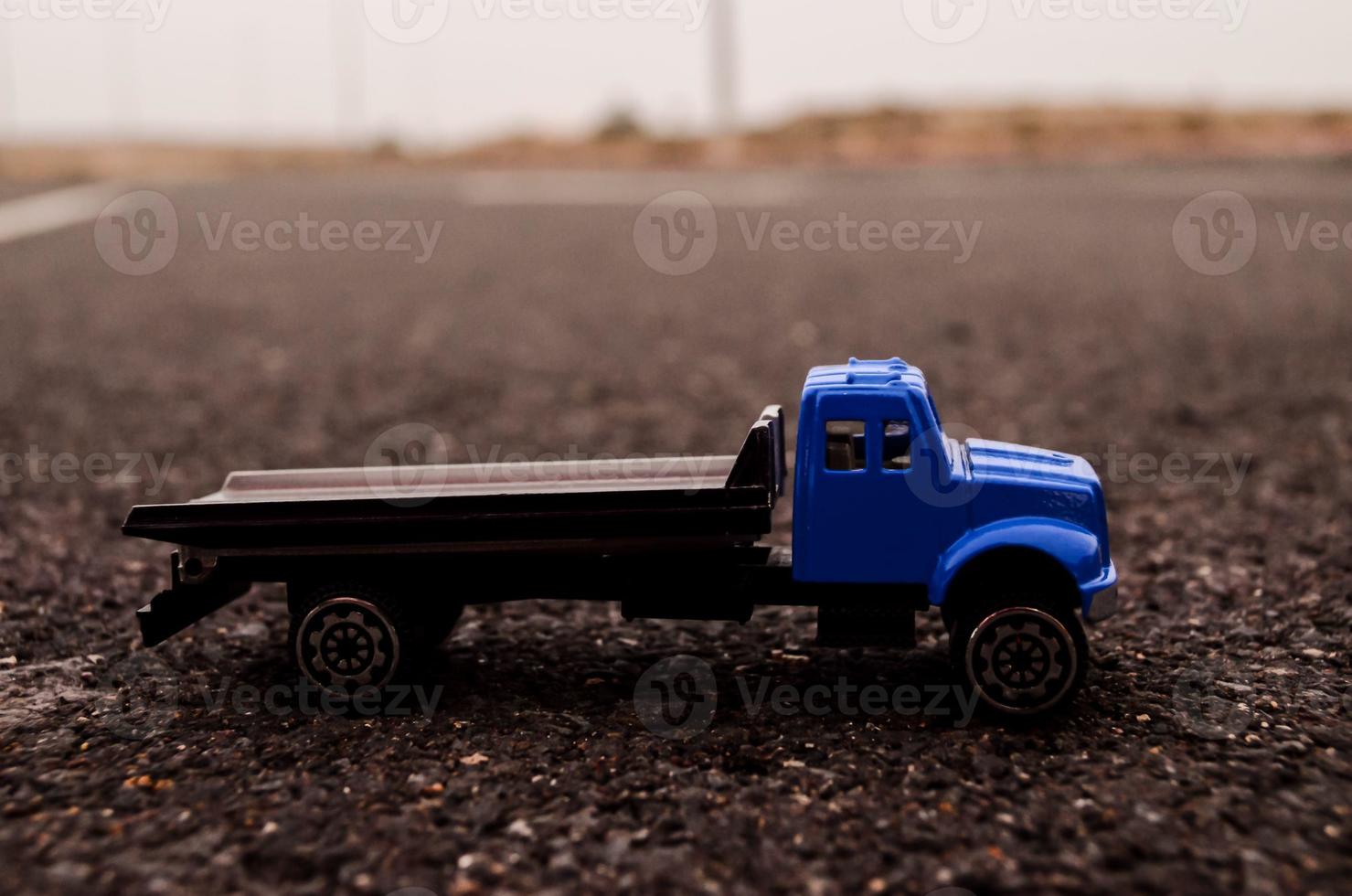 Toy truck on the road photo