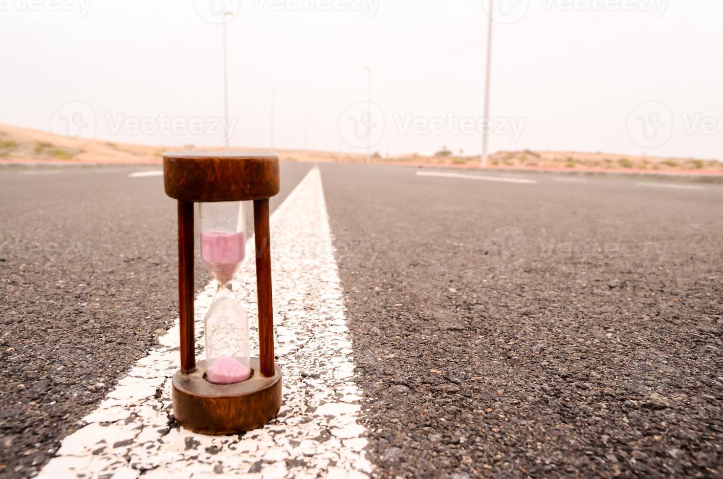 Hourglass on the road photo