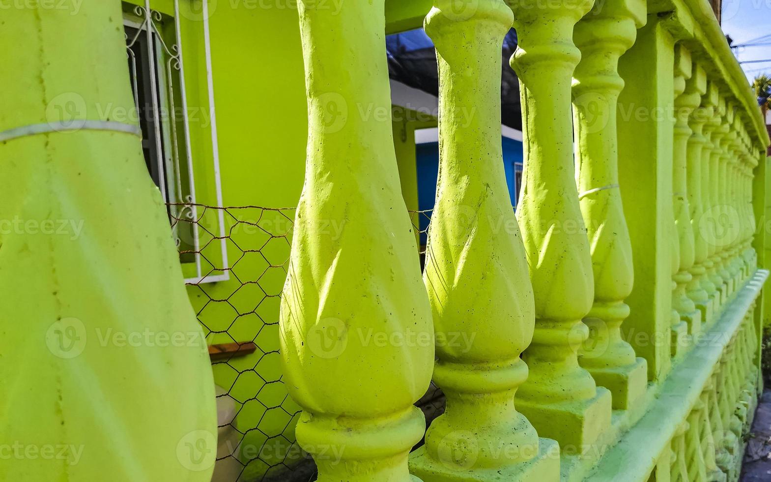 Green stone columns as fence in  Playa del Carmen Mexico. photo