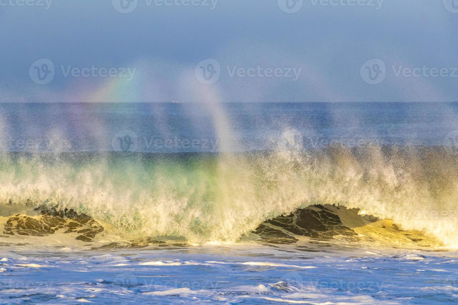 Extremely high huge waves with rainbow in Puerto Escondido Mexico. photo