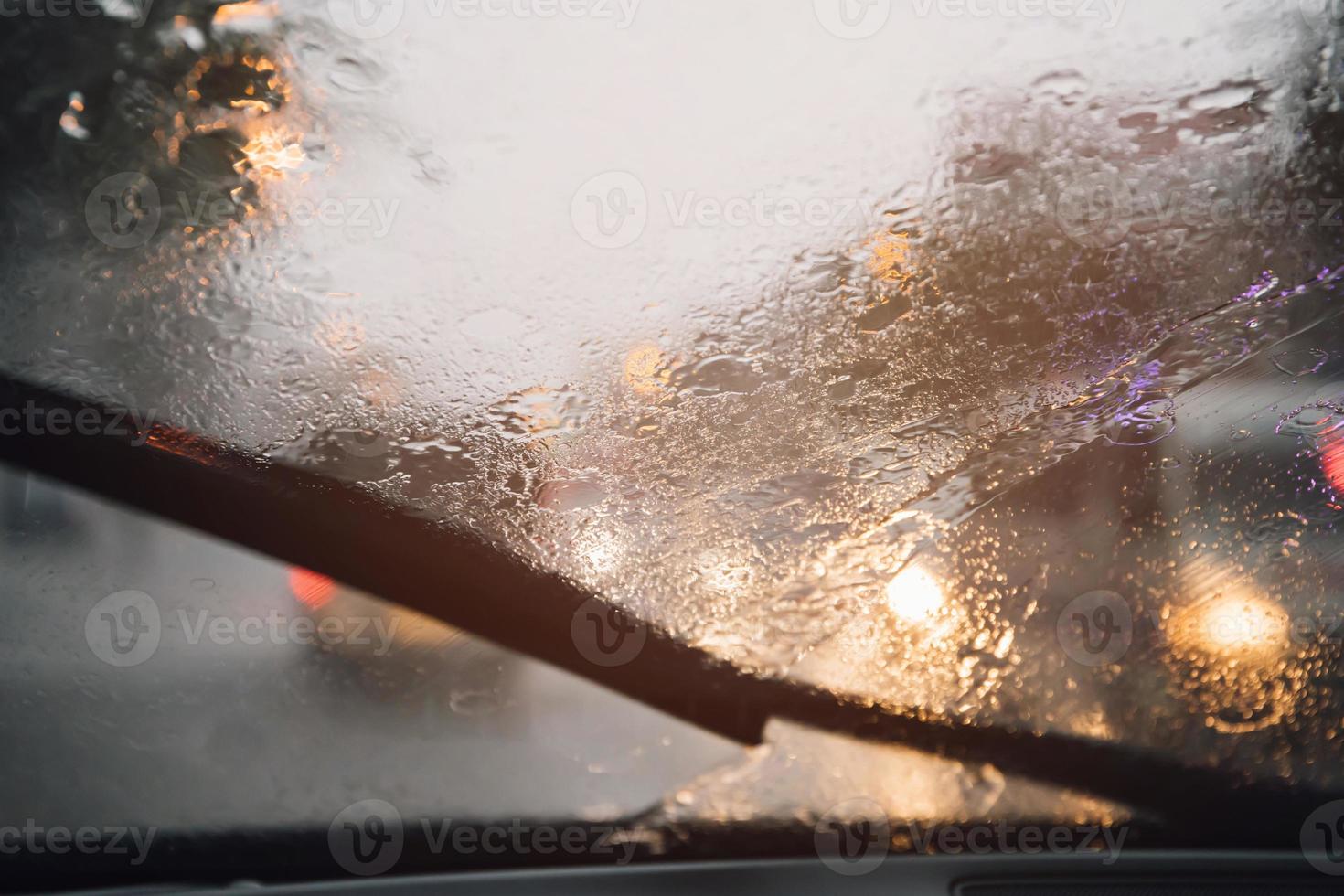 Drizzle on the windshield in the evening. photo