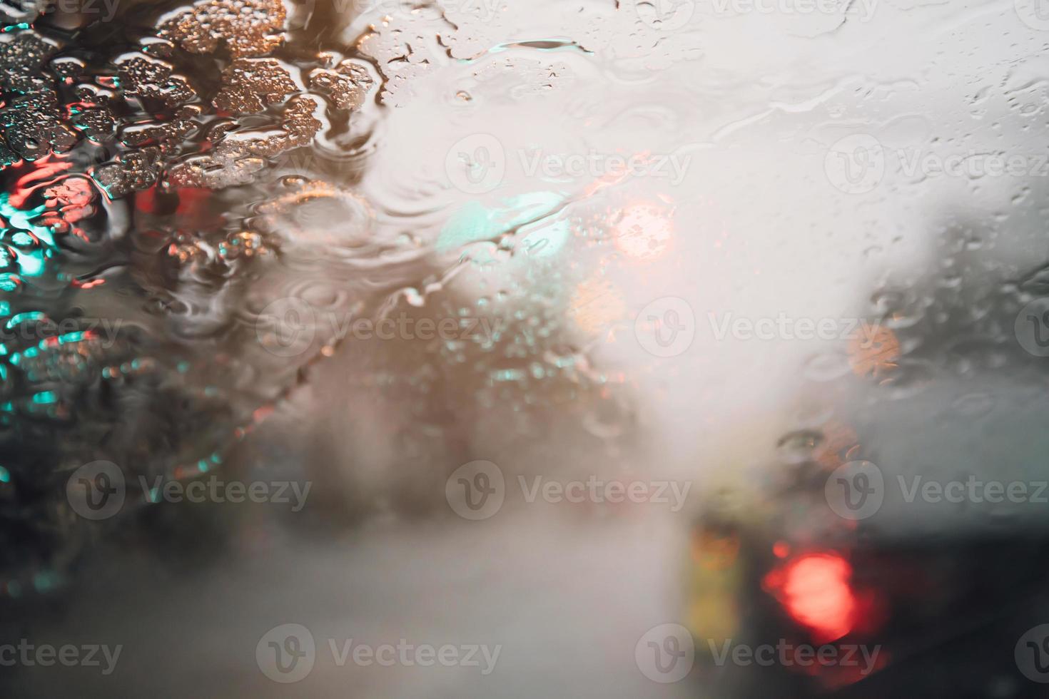 Drizzle on the windshield in the evening. photo