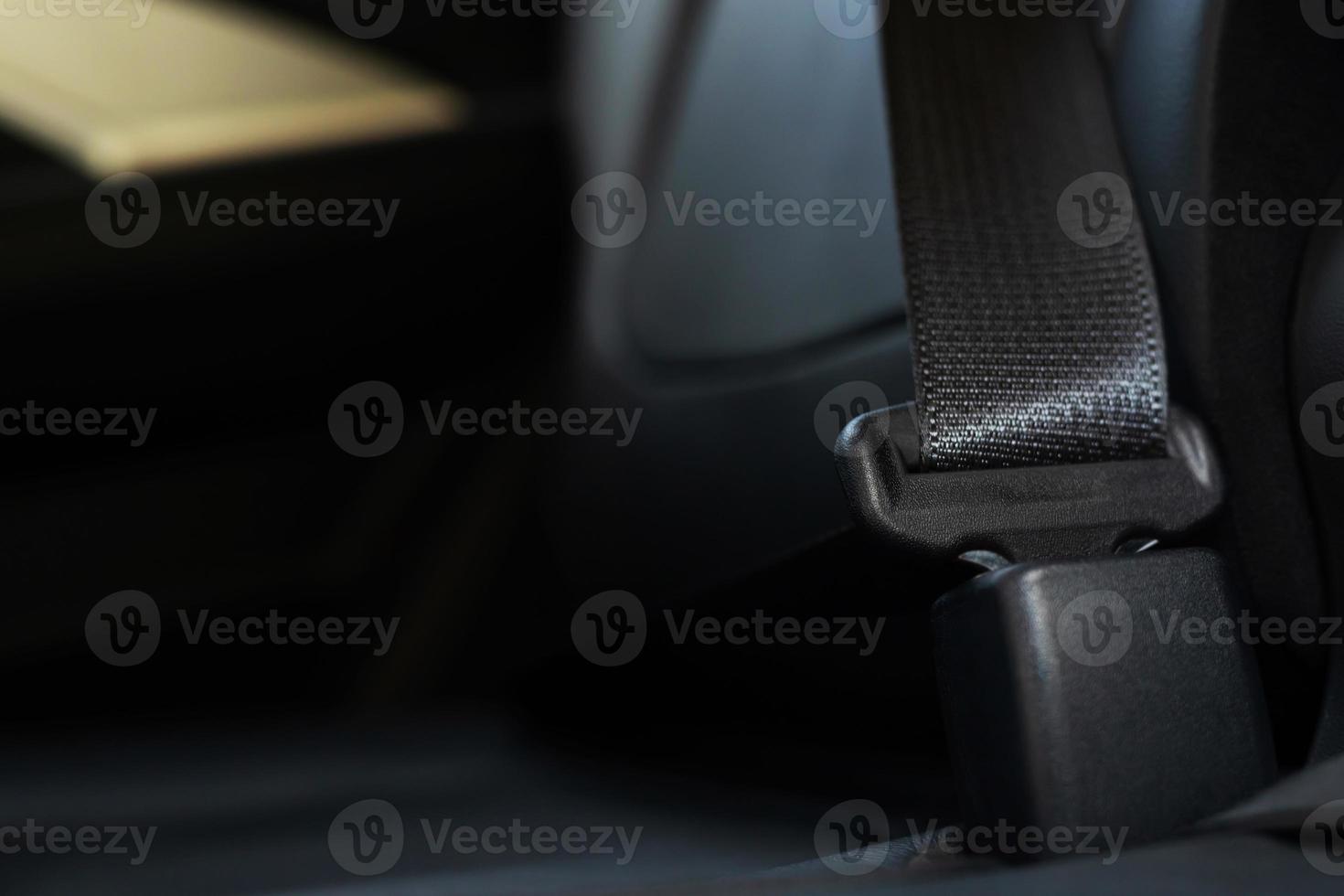 Close Up of people business man hand fastening seat safety belt in car photo