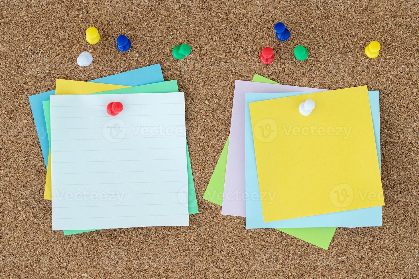 collection of colorful variety post. paper note reminder sticky notes pin on cork bulletin board. photo