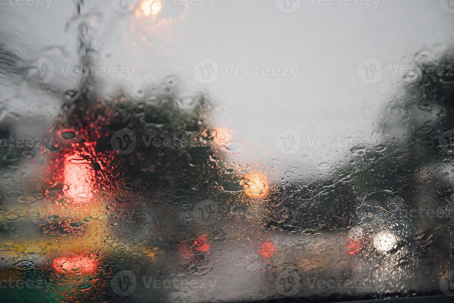 Drizzle on the windshield in the evening. photo