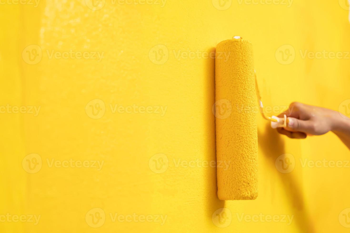 Roller Brush Painting, Worker painting on surface wall Painting apartment photo