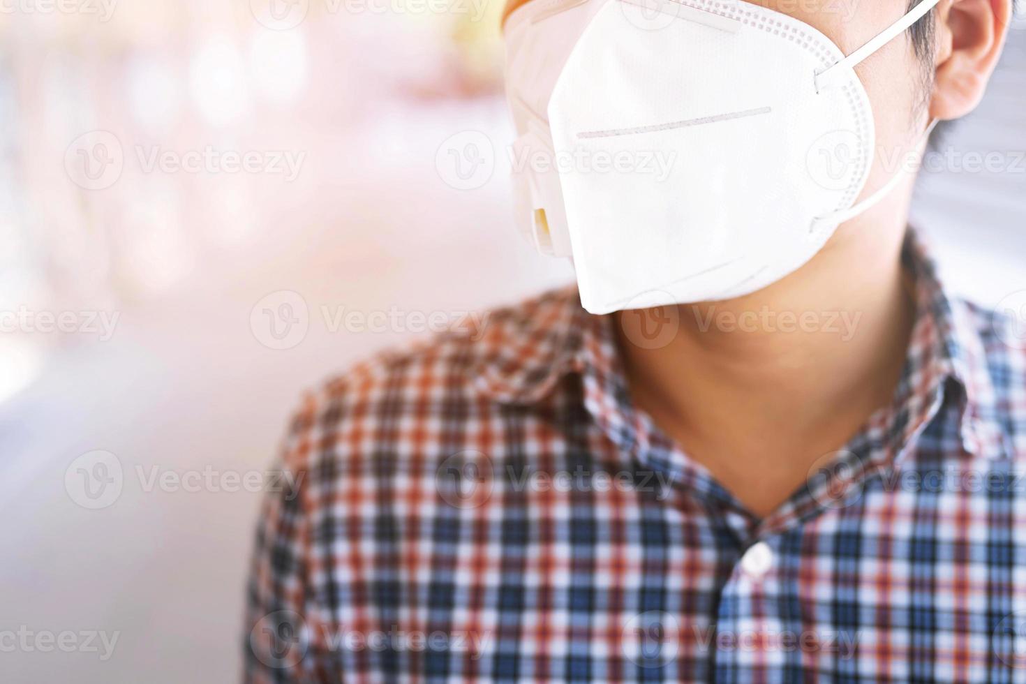 man are going to work.he is wearing a mask N95. To prevent dust, pm 2.5 photo