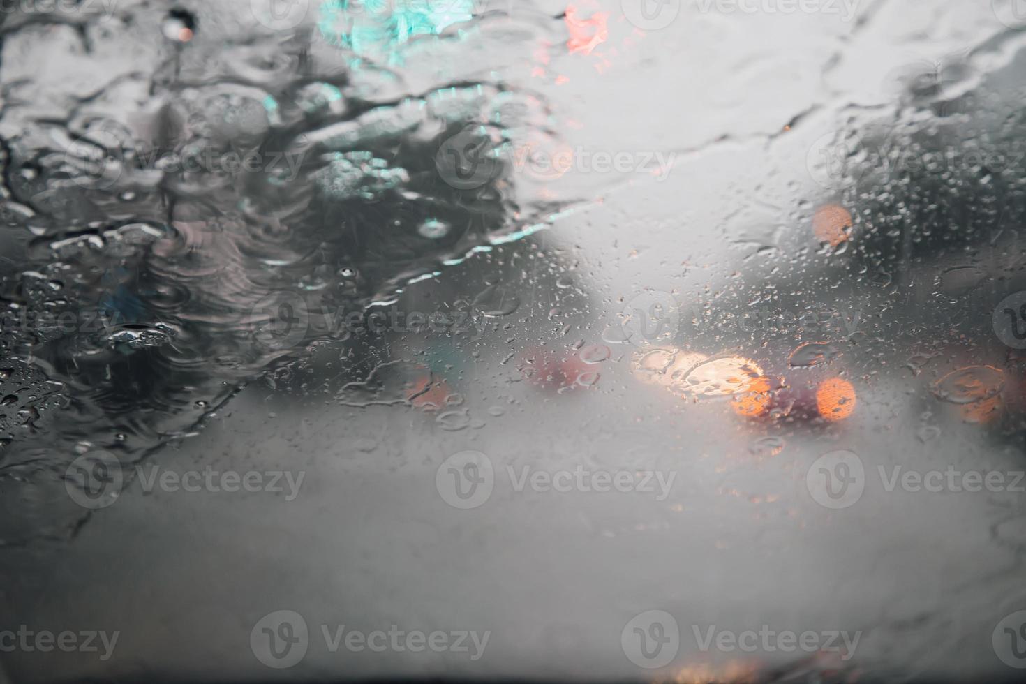 Drizzle on the windshield in the evening. photo