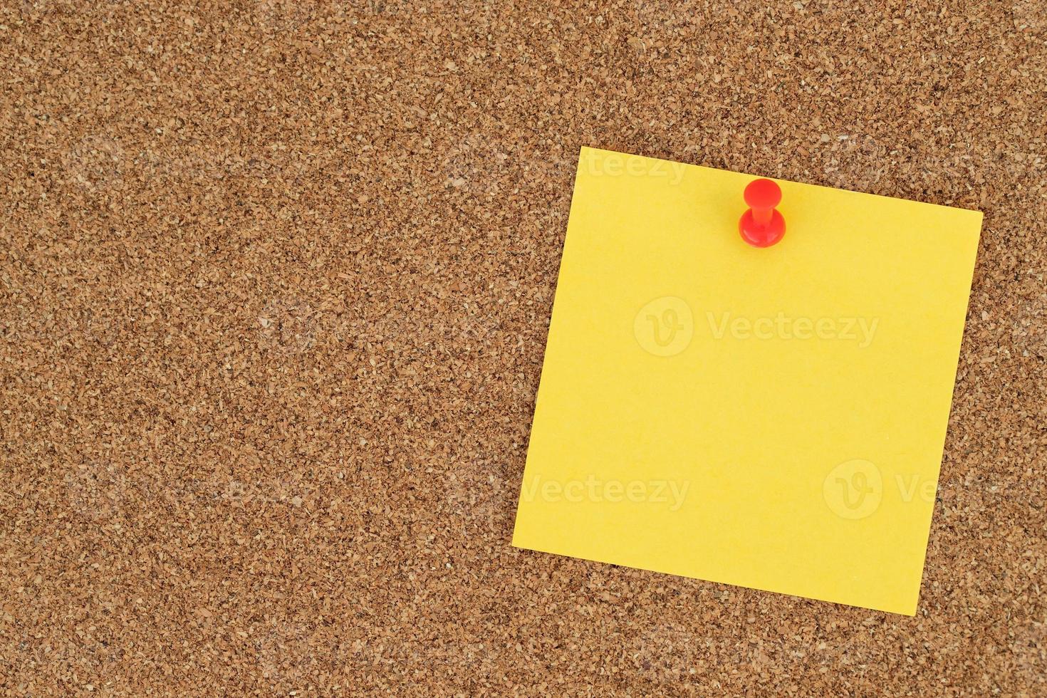 collection of colorful variety post. paper note reminder sticky notes pin on cork bulletin board. photo