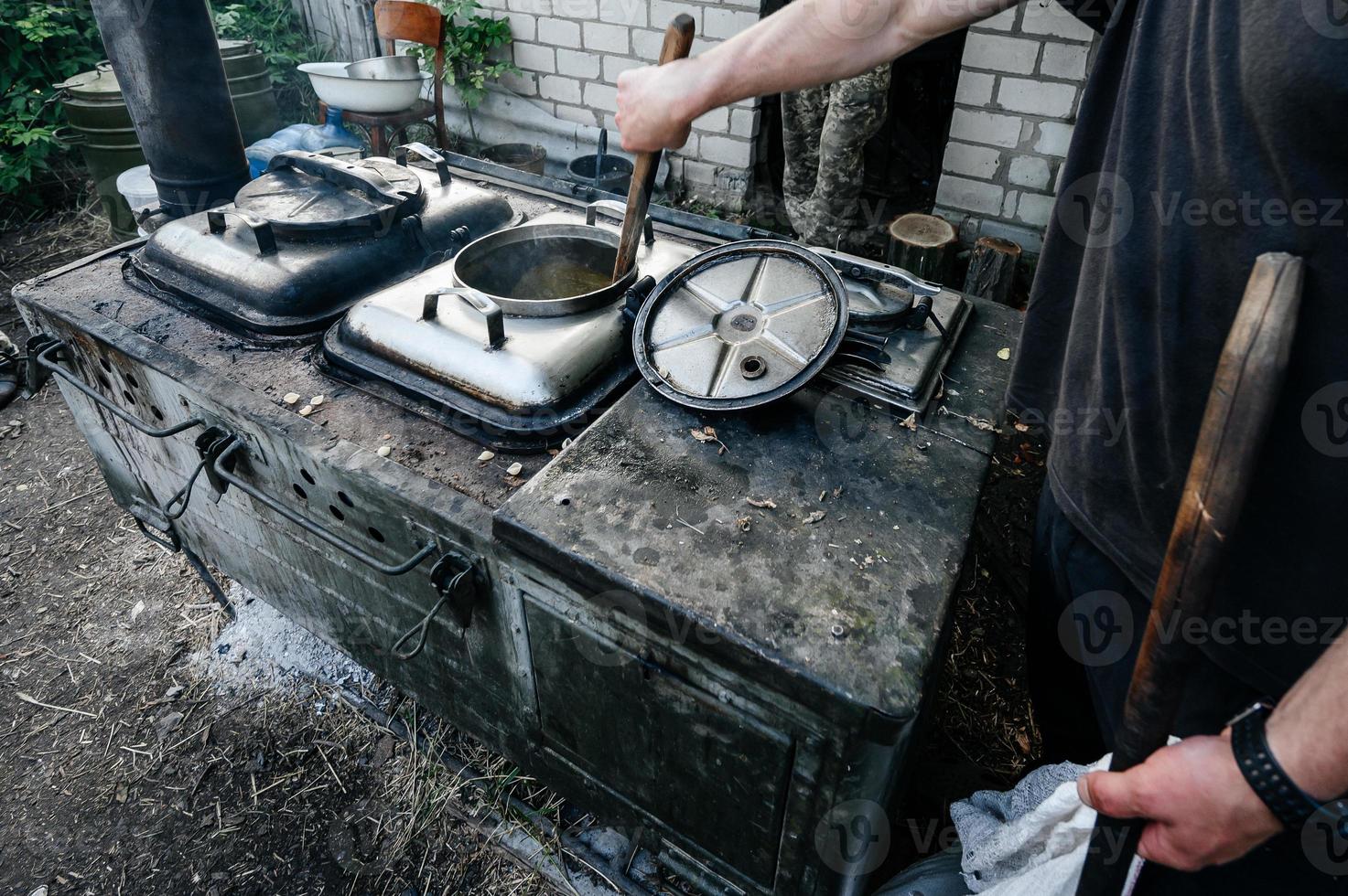 Cooking in the field during the war, field kitchen of the Ukrainian military. photo
