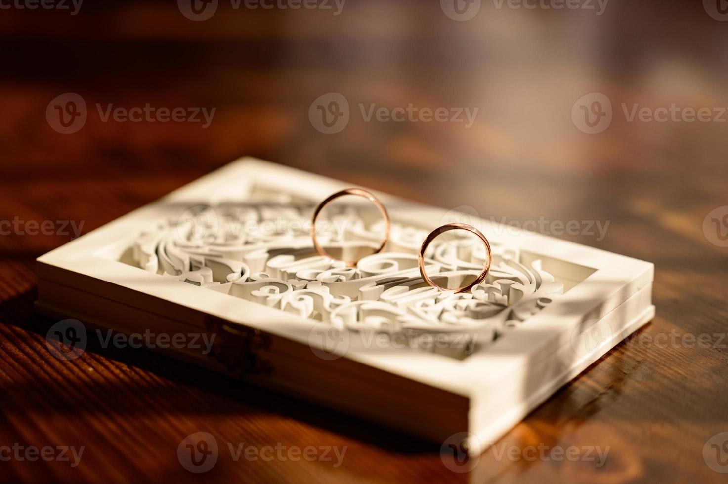 Gold rings of newlyweds, wedding accessories, rings close-up. photo