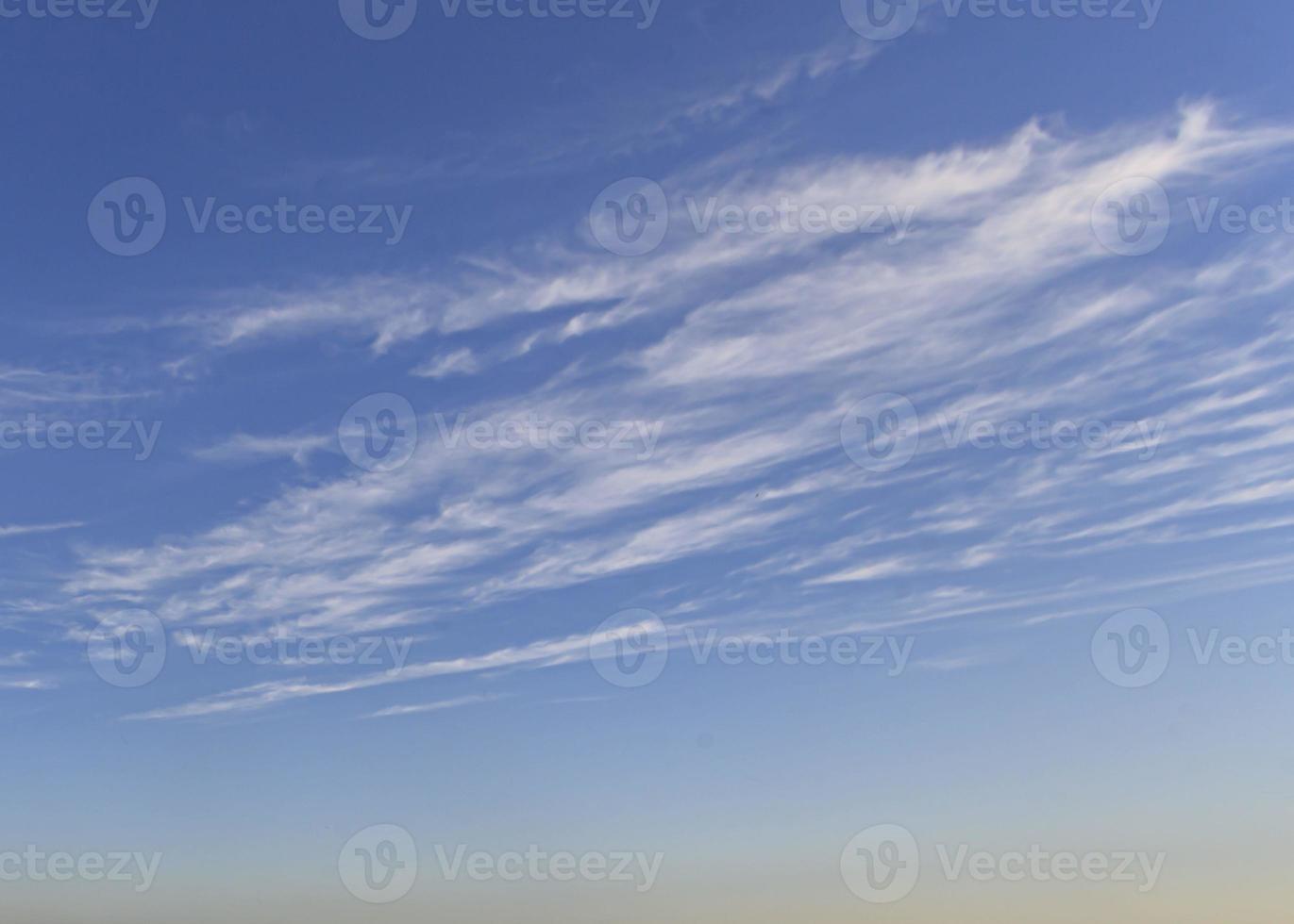 Image of a partly cloudy and partly clear sky during the day photo