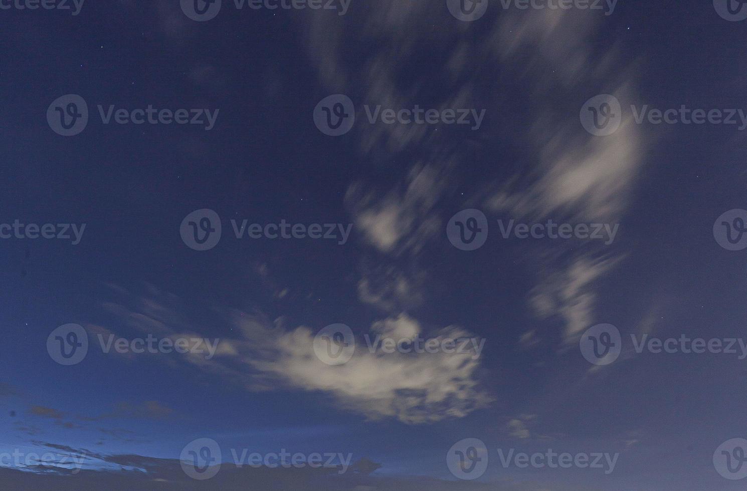 Image of a partly cloudy and partly clear sky during the day photo