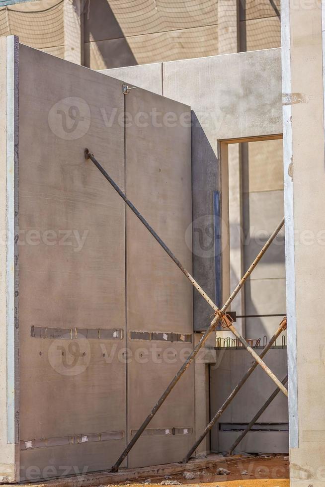 Construction site with precast concrete columns, beams and walls photo