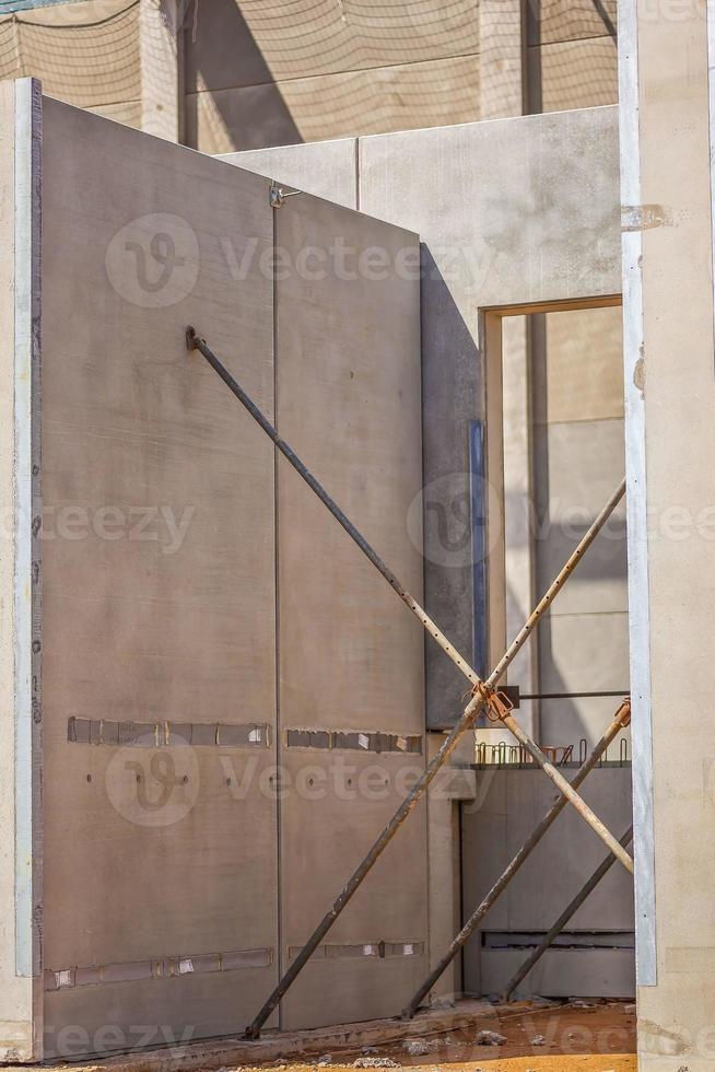 Construction site with precast concrete columns, beams and walls photo